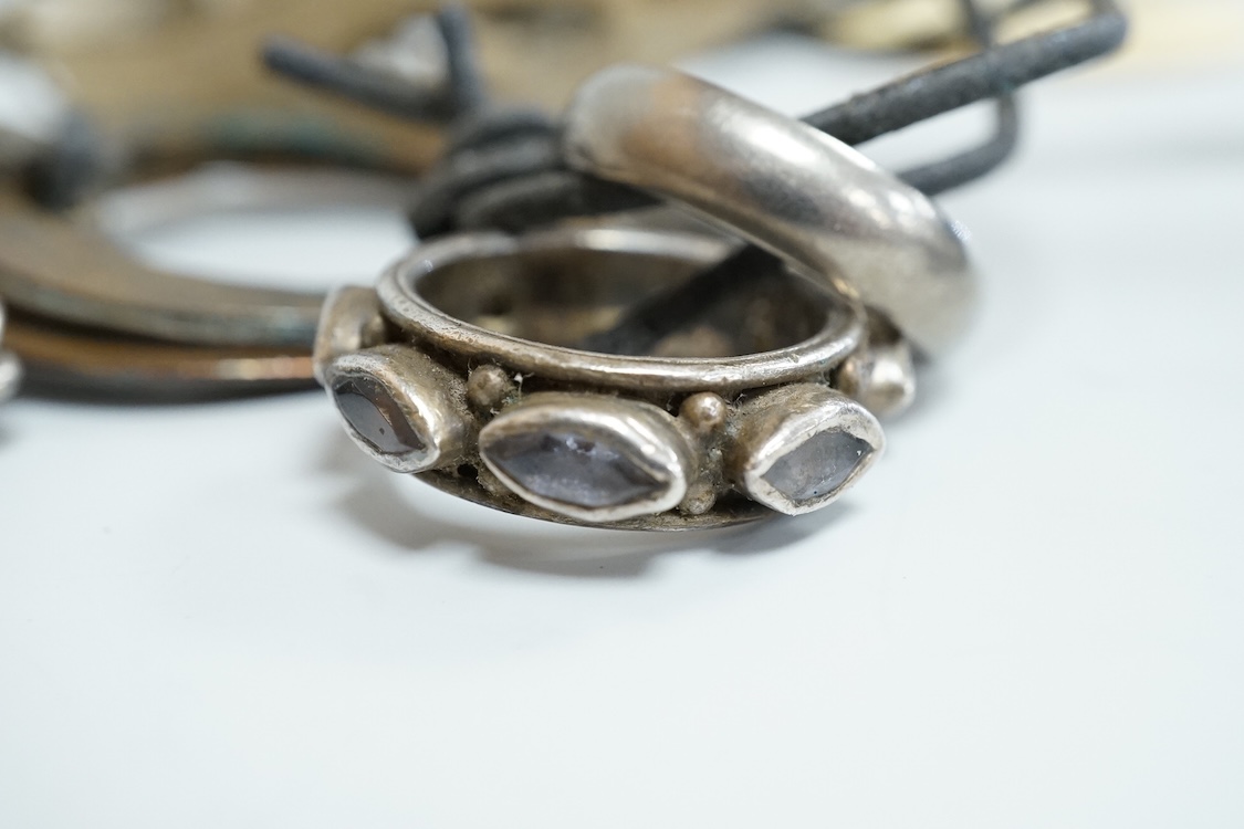 A George V silver circular vesta case, S. Blanckensee & Son Ltd, Birmingham, 43mm, together with a damaged silver child's rattle by George Unite, a cat child's rattle, white metal and lapis lazuli set fob, etc.